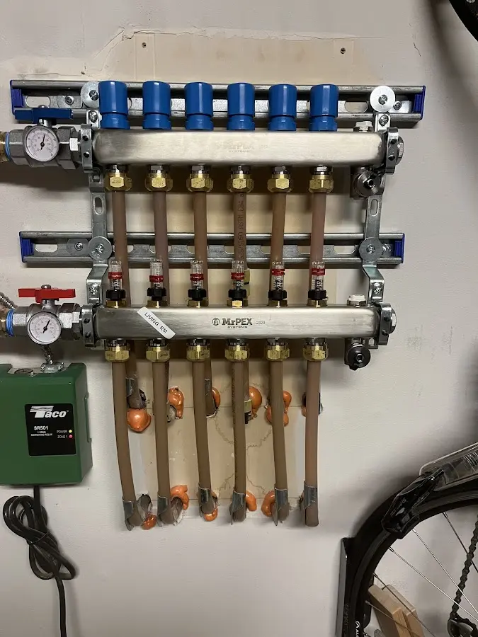 Plumber performing Water Heater Repair at a residential property in Hendron